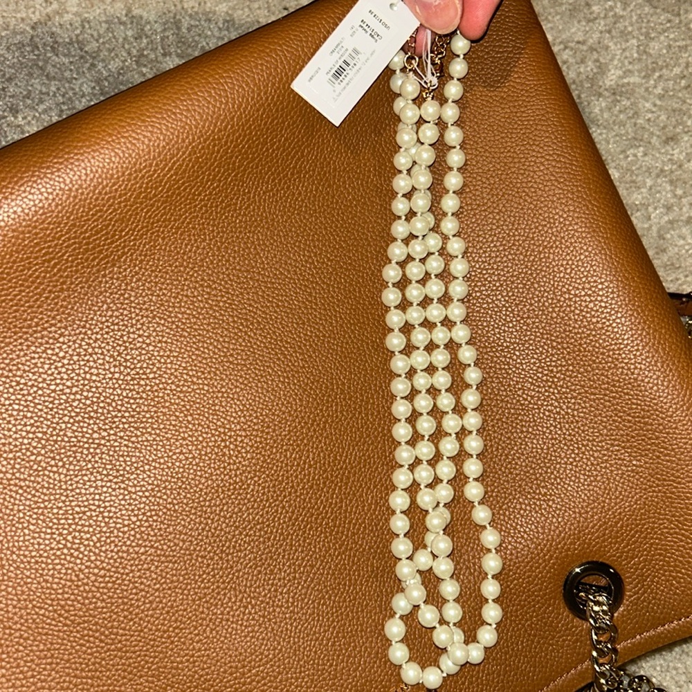 Kate spade long pearl necklace can be doubled/layered.